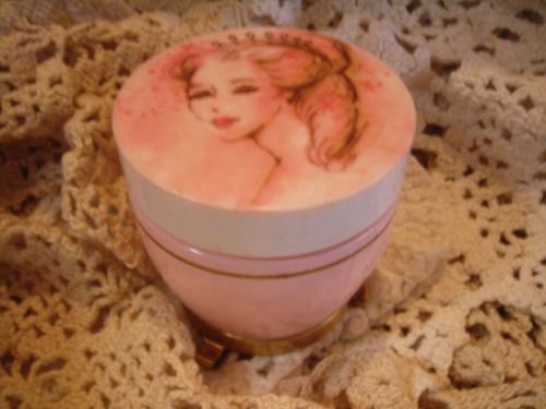 ohmygawd. i could NOT walk away from this beauty. it's a vintage pink cosmetic jar with a gorgeous vintage lady on the lid. how wonderful is that?!