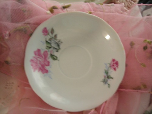 hold the phone. forgot about this little treasure! a little rose saucer. wanna guess? FIVE WHOLE CENTS!! my kinda sale!